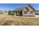 Charming single-Gathering home with well-maintained lawn, mature landscaping, and classic architectural details at 125 Round Tuit Ln, Mt Ulla, NC 28125