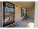 Welcoming front porch with seating area, charming accents, and views of the landscaped yard at 125 Round Tuit Ln, Mt Ulla, NC 28125