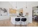 Bright kitchen with wood cabinets, quartz countertop island, and stylish pendant lighting at 125 Round Tuit Ln, Mt Ulla, NC 28125