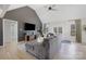 Comfortable living room with a large gray sectional sofa and a mounted flat screen television at 125 Round Tuit Ln, Mt Ulla, NC 28125
