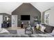 Modern living room showcasing a gray accent wall, comfortable seating, and stylish decor at 125 Round Tuit Ln, Mt Ulla, NC 28125