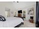 Main bedroom featuring a ceiling fan, carpeted floors, and access to the ensuite bathroom and an outdoor space at 125 Round Tuit Ln, Mt Ulla, NC 28125