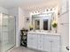 Bright bathroom featuring double sink vanity, quartz countertop, and a glass shower door at 1365 Eagle Claw Dr, Kannapolis, NC 28083