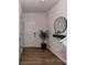 Stylish foyer featuring wood-look floors, a decorative mirror, and modern accents at 1365 Eagle Claw Dr, Kannapolis, NC 28083