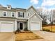 Charming townhome with light gray siding, black shutters, and an attached one-car garage at 1365 Eagle Claw Dr, Kannapolis, NC 28083