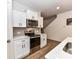 This kitchen has white cabinets, stainless steel appliances, and a stylish backsplash at 1365 Eagle Claw Dr, Kannapolis, NC 28083