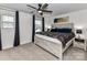 A main bedroom with a ceiling fan, neutral paint, and a decorative headboard at 1365 Eagle Claw Dr, Kannapolis, NC 28083
