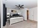 Main bedroom featuring a ceiling fan, ample closet space, and a large window at 1365 Eagle Claw Dr, Kannapolis, NC 28083