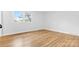 Bright bedroom features hardwood floors and a window letting in natural light at 137 Dellinger Dr, Statesville, NC 28625