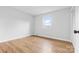 A cozy bedroom with hardwood floors and a view to the outdoors at 137 Dellinger Dr, Statesville, NC 28625