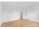 This bedroom features hardwood floors and a closet for storage space at 137 Dellinger Dr, Statesville, NC 28625