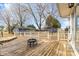 Outdoor wooden deck showcasing a fire pit, perfect for entertaining in a backyard setting with storage sheds at 137 Dellinger Dr, Statesville, NC 28625