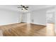 Bright living room with wood-look flooring, fresh white paint, and natural light from nearby windows at 137 Dellinger Dr, Statesville, NC 28625