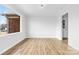 Bright living room featuring wood-look flooring and a large window with natural light at 137 Dellinger Dr, Statesville, NC 28625