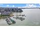 Stunning aerial view of lake community featuring boat docks and waterfront homes at 14021 Queens Harbor Rd, Charlotte, NC 28278
