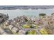 Aerial view of waterfront condos, showcasing lush landscaping and the community's prime location on the lake at 14021 Queens Harbor Rd, Charlotte, NC 28278