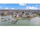 Stunning aerial shot of waterfront condos with a boat dock offering picturesque views and convenient access to the water at 14021 Queens Harbor Rd, Charlotte, NC 28278