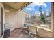 Enjoy wooded views from this private balcony, complete with awning and patio furniture at 14021 Queens Harbor Rd, Charlotte, NC 28278