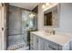 Bathroom with a gray shower, brushed nickel faucet, and modern vanity at 14021 Queens Harbor Rd, Charlotte, NC 28278