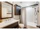 Bathroom featuring modern finishes, a vanity, and a shower and tub combo at 14021 Queens Harbor Rd, Charlotte, NC 28278