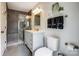 The bathroom features a gray tile shower and a modern vanity at 14021 Queens Harbor Rd, Charlotte, NC 28278