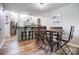 Eat-in kitchen with access to a modern dining area and hardwood floors at 14021 Queens Harbor Rd, Charlotte, NC 28278