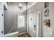 Bright entryway featuring hardwood floors, chandelier lighting, and a charming mail organizer near the front door at 14021 Queens Harbor Rd, Charlotte, NC 28278