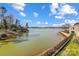 Picturesque lake view highlighting the waterfront landscape and blue skies at 14021 Queens Harbor Rd, Charlotte, NC 28278