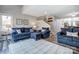 Spacious living room with plush seating, stairs, and hardwood floors at 14021 Queens Harbor Rd, Charlotte, NC 28278
