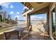 Outdoor patio with seating and a stunning view of the lake at 14021 Queens Harbor Rd, Charlotte, NC 28278