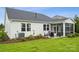 Backyard view featuring a screened porch, patio, and landscaping at 2022 Mantle Ridge Dr, Indian Trail, NC 28079