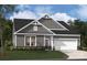 New construction home features a gray color palette and a two-car garage at 2022 Mantle Ridge Dr, Indian Trail, NC 28079