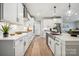 Modern kitchen boasts white cabinets, stainless steel appliances, and a stylish island sink at 2022 Mantle Ridge Dr, Indian Trail, NC 28079