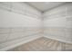 Large walk-in closet with ample shelving and storage space at 2022 Mantle Ridge Dr, Indian Trail, NC 28079