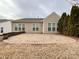 Spacious brick back patio perfect for entertaining, framed by mature trees and a neutral-toned home exterior at 2023 Moultrie Ct, Fort Mill, SC 29707