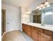 Bathroom with a double sink vanity, large mirror, and a tiled shower stall at 2023 Moultrie Ct, Fort Mill, SC 29707