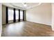 Bright bedroom boasts trey ceiling, wood floors, and plentiful natural light at 2023 Moultrie Ct, Fort Mill, SC 29707