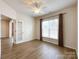 Bedroom featuring wood flooring, neutral walls, ceiling fan, and natural light at 2023 Moultrie Ct, Fort Mill, SC 29707