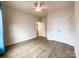 Bedroom with hardwood floors, a ceiling fan, and a double door closet at 2023 Moultrie Ct, Fort Mill, SC 29707