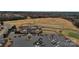 Aerial view of the golf clubhouse with beautiful landscaping and ample parking at 2023 Moultrie Ct, Fort Mill, SC 29707
