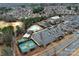 Aerial view showcasing community amenities including pool, tennis courts, and clubhouse in a wooded setting at 2023 Moultrie Ct, Fort Mill, SC 29707
