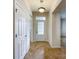 Bright foyer with tiled floor, decorative light fixture, and view of the front door at 2023 Moultrie Ct, Fort Mill, SC 29707
