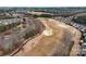 Aerial view of a lush golf course surrounded by residential homes and scenic landscapes at 2023 Moultrie Ct, Fort Mill, SC 29707