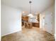 Open kitchen area with tile floor, island, and stainless steel microwave at 2023 Moultrie Ct, Fort Mill, SC 29707
