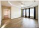 Spacious living room featuring hardwood floors and bright natural light from large windows at 2023 Moultrie Ct, Fort Mill, SC 29707