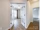 Office space through French doors, features wood flooring and a ceiling fan at 2023 Moultrie Ct, Fort Mill, SC 29707