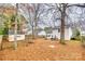 Backyard featuring a shed, basketball hoop, grill, fence, and fall foliage at 2232 Mancke Dr, Rock Hill, SC 29732