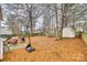 The backyard featuring a basketball hoop, shed, grill, and a patio at 2232 Mancke Dr, Rock Hill, SC 29732