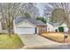 Traditional home with a two-car garage, driveway, and a well maintained front lawn at 2232 Mancke Dr, Rock Hill, SC 29732