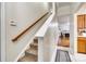 Carpeted stairs with wooden handrail leading to the upper level of the home at 2232 Mancke Dr, Rock Hill, SC 29732